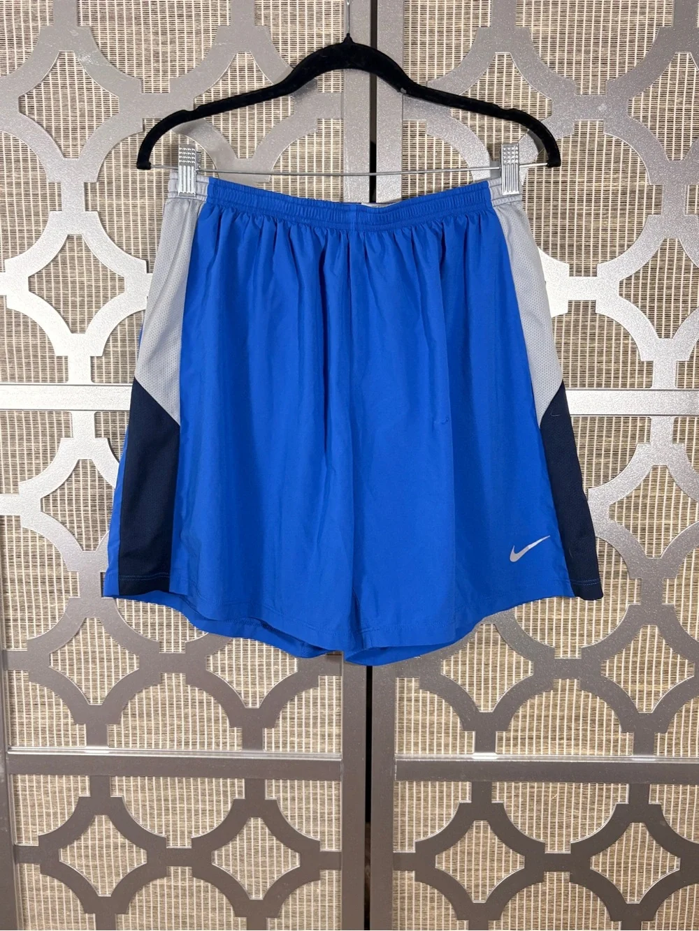 Nike Men’s Royal Blue Athletic Shorts with Gray & Navy Panels and has a snag
